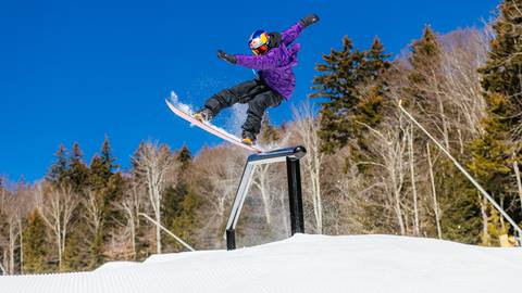 Snowboarder on rail