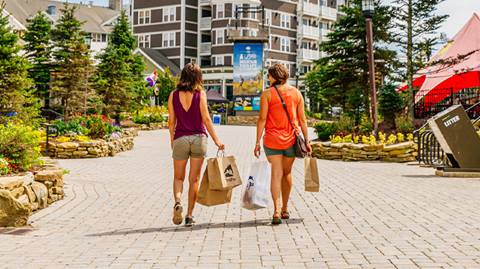 Friends shopping in the village at Snowshoe Mountain