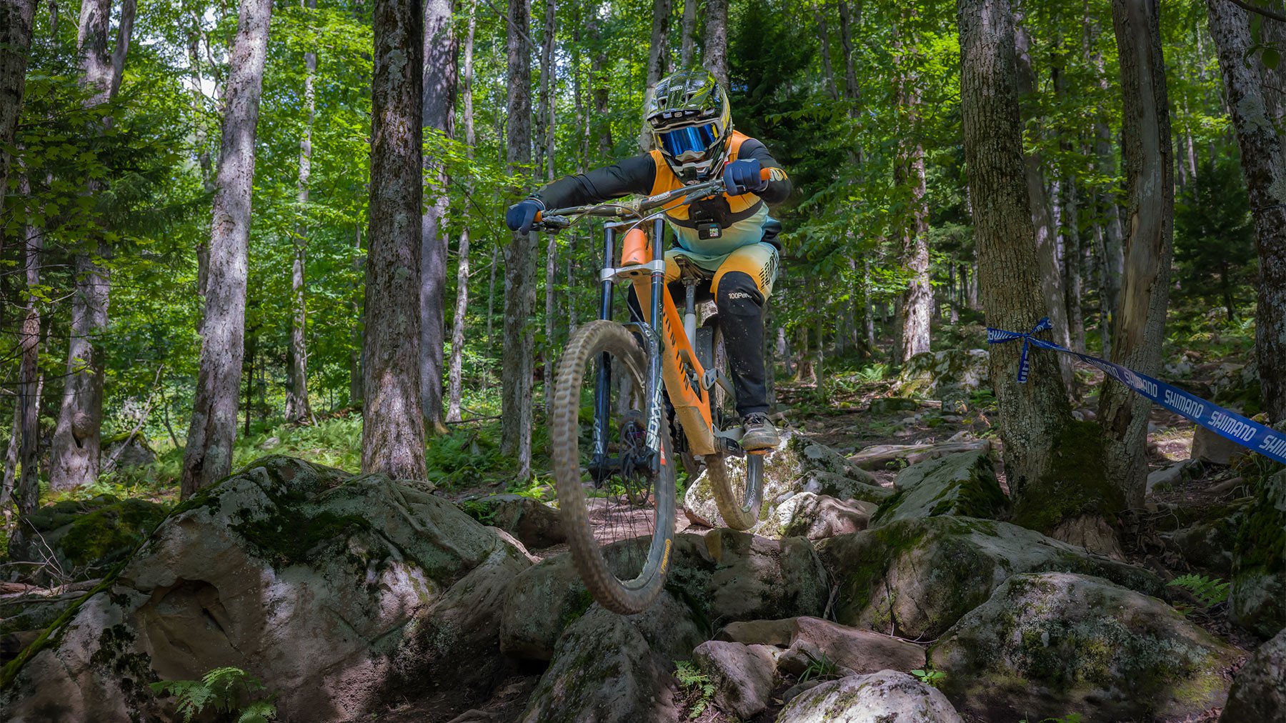 mountain biker going through a rock garden
