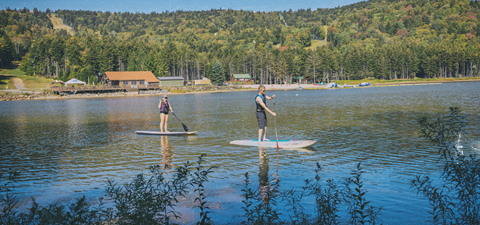 Two people paddleboarding on Shavers Lake