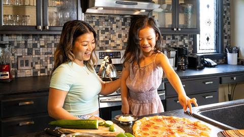 family with pizza