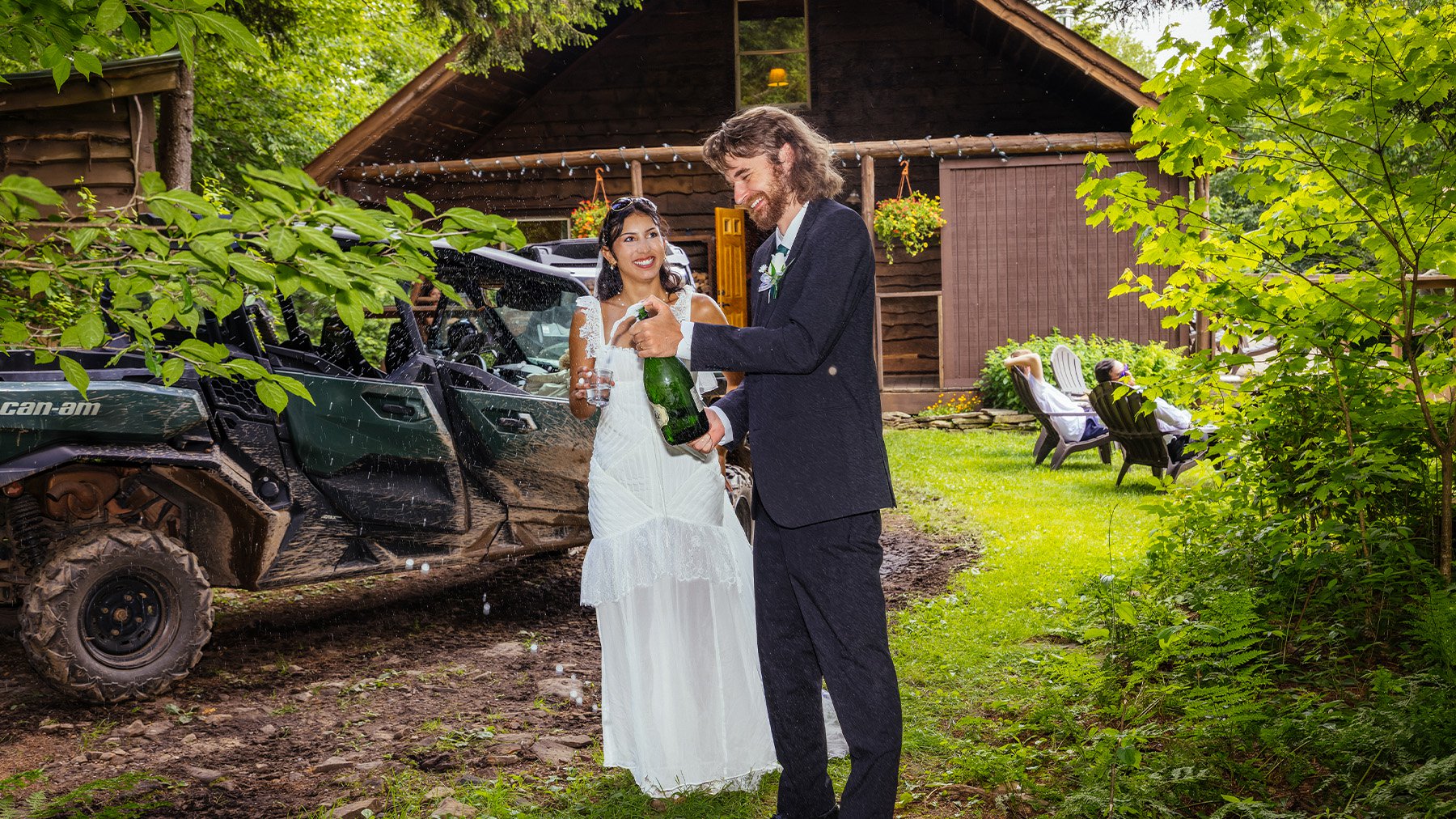 Popping a champagne bottle at the Backcountry Hut | Snowshoe Adventure Elopements