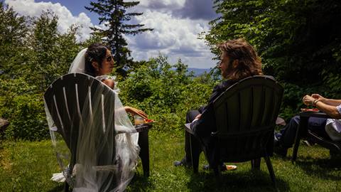Bride and groom enjoying charcuterie and the view at Snowshoe Mountain