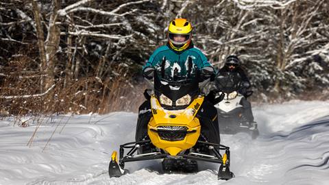 Snowmobiles in fresh powder at Snowshoe Mountain