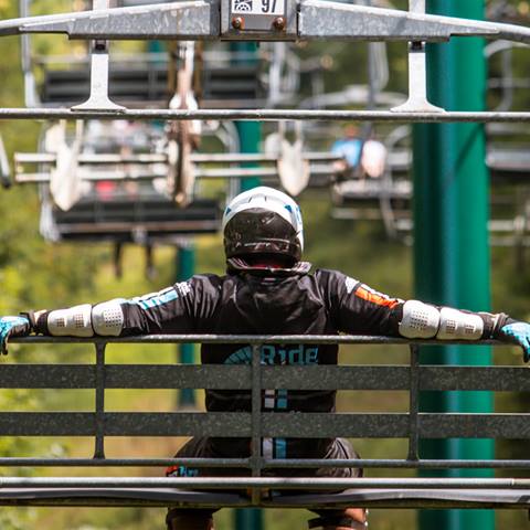 Mountain Biker on Chair Lift