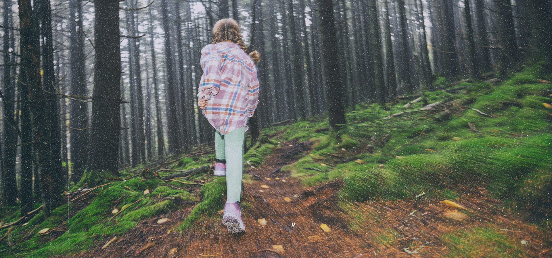 Child running on a hiking trail at Snowshoe Mountain