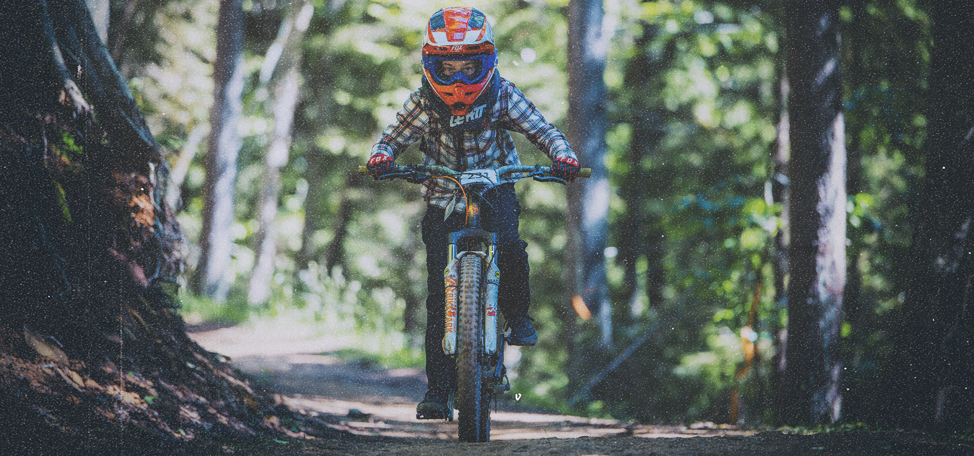Biker riding downhill at Snowshoe Mountain