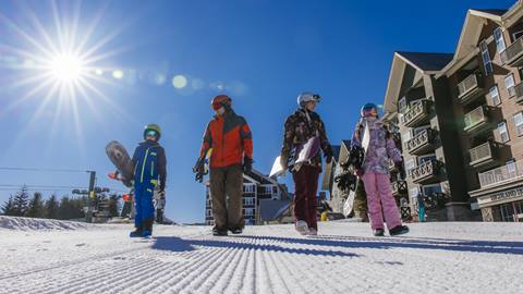 Family of snowboarders