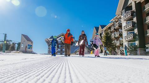 family of snowboarders at Snowshoe Mountain