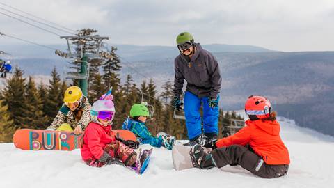Family gets strapped in at the top of a run