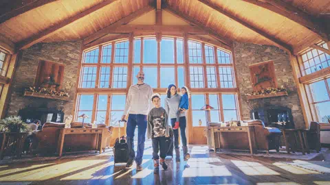 Family walking into a lodge at Snowshoe Mountain