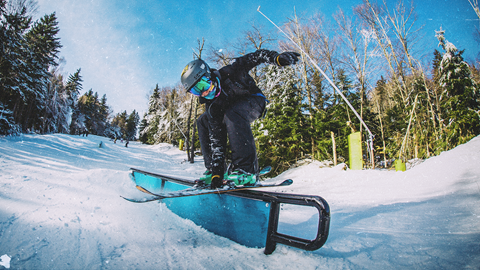 Skier hits a rail at Snowshoe Mountain