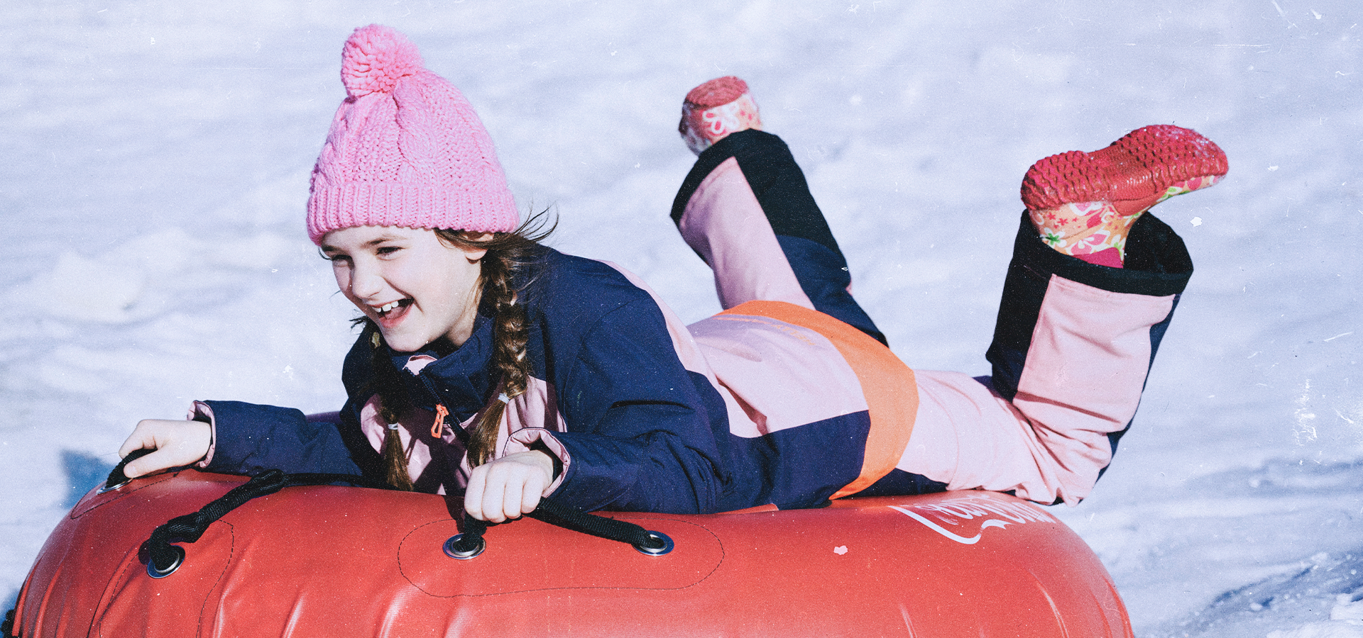 Girl tubing at Snowshoe Mountain